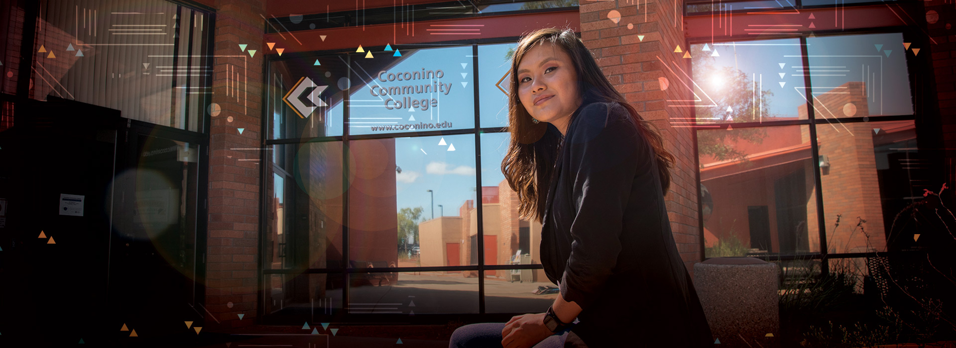 CCC student in front of the Page Campus Building
